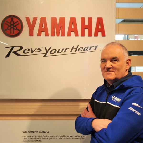 Man stood next to Yamaha logo Steve